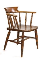 Lot 376 - A Victorian beechwood and elm smokers bow armchair