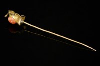 Lot 40 - A Victorian Gothic Revival gold and coral stick pin