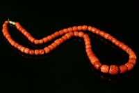 Lot 184 - A single row graduated coral bead necklace
