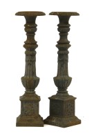 Lot 393 - A pair of cast iron pricket sticks