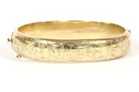 Lot 24 - A 9ct gold hinge bangle