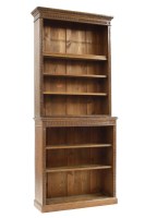 Lot 355 - A late Victorian oak two section open bookcase with carved leaf detail