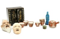 Lot 97 - A Japanese Kutani set of seven cups and a kettle
