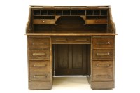 Lot 373 - An early 20th century oak roll top desk