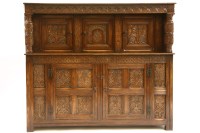 Lot 372 - A 17th century style oak court cupboard