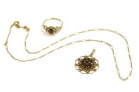 Lot 20 - A gold garnet and diamond ring