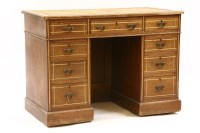 Lot 390 - An Edwardian oak pedestal desk