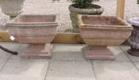 Lot 639 - A pair of composition garden urns