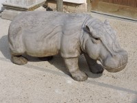 Lot 640 - A carved wooden hippo