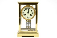 Lot 452 - A 19th century brass four glass mantel clock