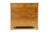 Lot 548 - A George III oak chest of two short above three long drawers on bracket feet