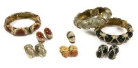 Lot 1526 - Three hinged bangles and earring suites