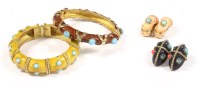 Lot 1527 - Two gold-plated and enamel hinged bangles