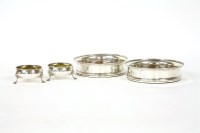Lot 229 - A pair of George III silver wine coasters