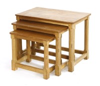 Lot 154 - A Robert 'Mouseman' Thompson oak nest of three tables