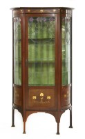 Lot 145 - An Art Nouveau bow front display cabinet