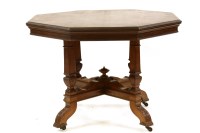 Lot 566 - A Victorian walnut octagonal centre table