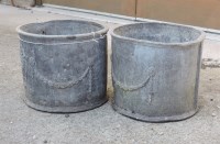 Lot 651 - A pair of circular lead planters