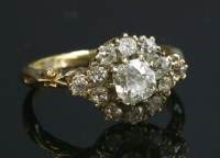 Lot 52 - A diamond set cluster ring