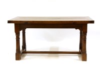 Lot 592 - An 18th century style oak drawer leaf refectory table