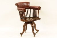 Lot 625 - An Edwardian mahogany and red leather upholstered swivel desk chair