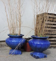 Lot 652 - Two blue glazed lobed urns