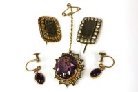 Lot 166 - A gold single stone oval amethyst brooch