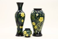 Lot 466 - Three Moorcroft 'Buttercup' pattern vases