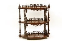 Lot 551 - A Victorian burr walnut three tiered whatnot