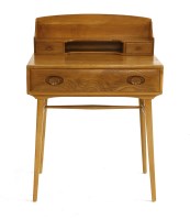 Lot 402 - An Ercol elm desk