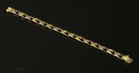 Lot 276 - An 18ct two colour gold curb link bracelet