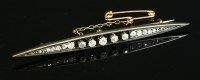 Lot 86 - A diamond set navette-shaped bar brooch