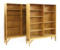 Lot 412 - A pair of Danish light oak open bookcases