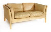 Lot 602 - A Danish tan leather two-seater settee