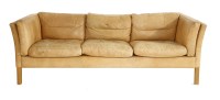 Lot 458 - A Danish tan leather three-seater settee