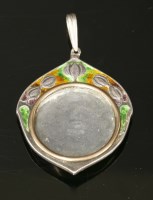 Lot 112 - A silver and enamelled picture locket pendant by William Hair Haseler