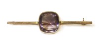 Lot 314 - An Edwardian gold single stone amethyst bar brooch