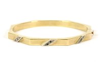 Lot 32 - A hollow gold octagonal hinge bangle