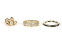 Lot 22 - A 9ct gold diamond set band ring