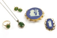 Lot 62 - A gold nephrite cabochon ring with rope border