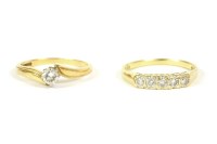 Lot 30 - An 18ct gold single stone diamond crossover ring