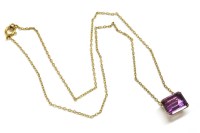 Lot 46 - A gold emerald cut amethyst pendant
