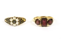 Lot 31 - A gold three stone garnet ring