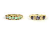 Lot 47 - A 9ct gold graduated seven stone opal ring