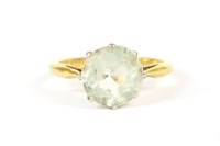 Lot 41 - A gold single stone round cut aquamarine ring