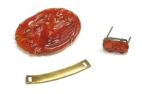 Lot 23 - An Asian carved and pierced Cornelian plaque