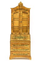 Lot 557 - A small lacquered bureau bookcase