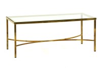 Lot 591 - A lacquered brass and glass low occasional table