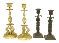 Lot 149 - A pair of bronze candlesticks