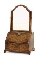 Lot 775 - A walnut dressing mirror